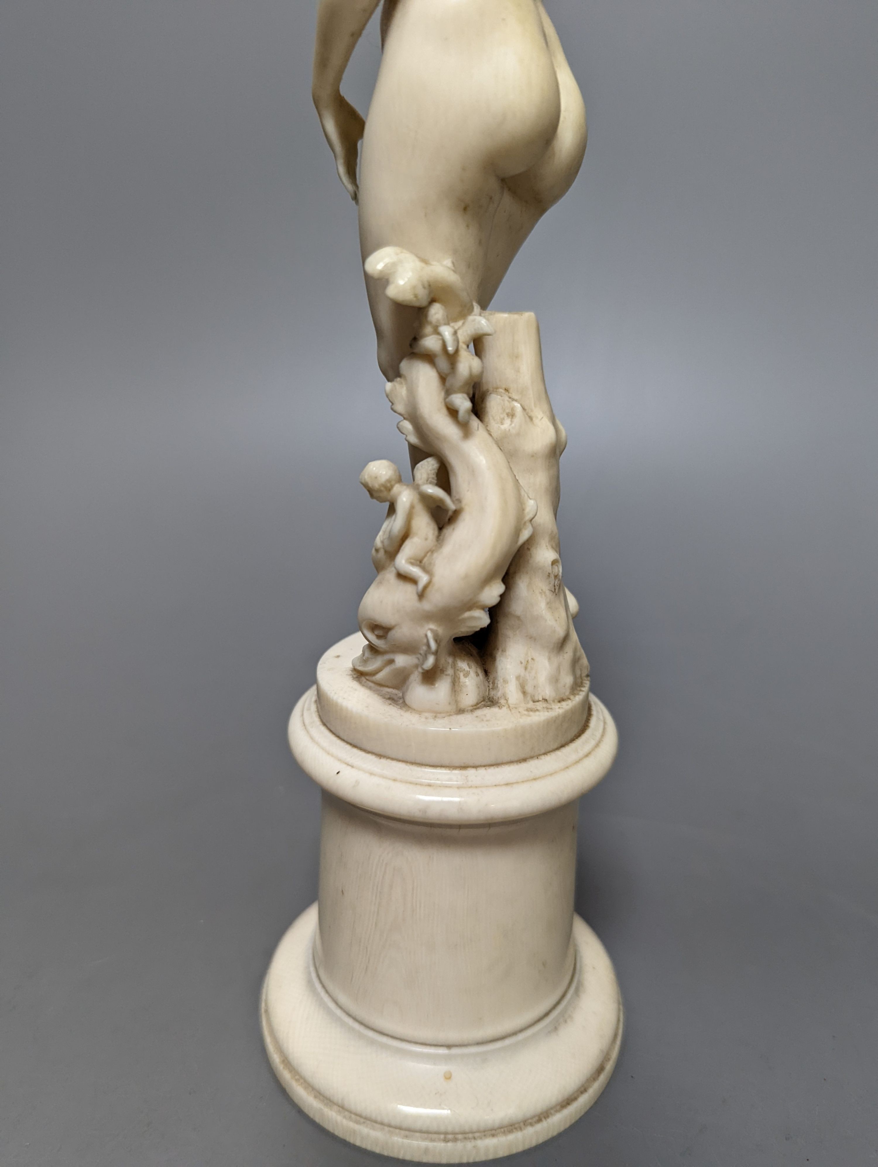 A 19th century Dieppe ivory figure after the antique ‘Venus with dolphin’ 25cm